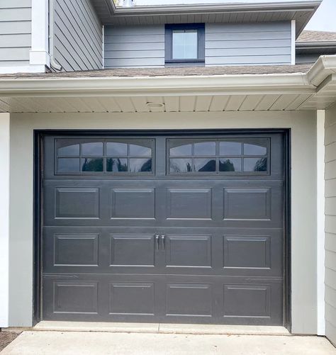 Want the look of carriage doors without the cost? Update your curb appeal with a garage door makeover. It's all about the hardware and windows Update Garage Doors, Small Garage Door, Grey Garage Doors, Black Garage Doors, Roll Up Garage Door, Double Garage Door, Garage Door Windows, Black Garage, Modern Garage Doors