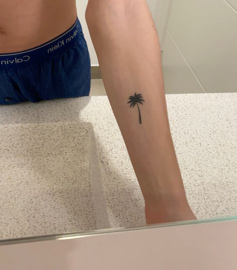 Palm Tree Tattoo Minimal, Ankle Tattoo Palm Tree, Palm Tree Tattoo Men, Single Needle Palm Tree Tattoo, Small Palm Tree Tattoo Ankle, Palm Tree Water Tattoo, Tree Tattoo Men, Palm Tattoos, Palm Tree Tattoo