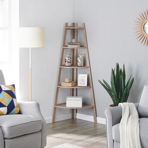 A corner bookcase, so even the smallest apartments can get some extra stylish storage space. Corner Ladder Shelf, Display Bookshelf, Ladder Display, Furnitur Ruang Keluarga, Decorative Shelving, Corner Bookshelves, Corner Space, Shelf Bookcase, Corner House