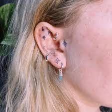 Tattoo Ears, Inner Ear Tattoo, Tattoo Ear, Sparkle Tattoo, Small Back Tattoos, Russian Tattoo, Ear Tattoo Ideas, Ear Tattoos, Face Tattoos