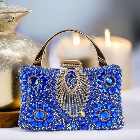 Absolutely Stunning! Mesmerizing Stones In A Retro Pattern Shine Across A Blue Evening Bag That Is Finished With A Chain Handle. This Is The Evening Bag! Stunning And Unique! 2.5l Detachable Single Handle. 22l Detachable Chain Strap. Vegan Leather With Lined Interior. Top Clasp Closure. Silver Toned Hardware. 8l X 5h X 2.5w Leather Lavish Glamour 60s 70s 80s 90s Glitzy Modern Spring Summer Fall Winter Cruise Highly Visible Artsy Sexy Flashy Glamorous Versatile Casual Boho Free Spirit Hippie Fest Winter Cruise, Lounge Party, Hippie Festival, Beaded Purses, Blue Gems, Rhinestone Studs, Retro Pattern, Boho Casual, Shoulder Handbag