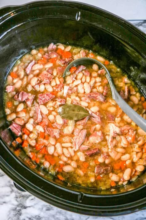 This easy Crockpot Ham and Beans is Slow Cooked to Perfection! It's a family fan favorite soup and comfort food. Made with simple ingredients Ham Soup Crockpot, Hambone Soup, Bean Soup Crockpot, Ham Beans, Crockpot Ham And Beans, Delicious Meal Prep Recipes, Crock Pot Ham, Crockpot Recipes Cheap, Budget Dinner Recipes