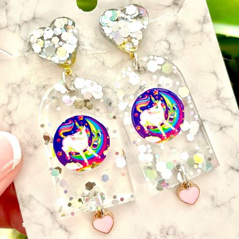 Lisa Frank Unicorn Moon Sticker Acrylic Earrings For Sale! These Earrings Are Absolutely Adorable. They Are Handmade By Me With Resin. Each Earring Has An Original Lisa Frank Sticker Embedded In It. They Are About 3 Inches Tall And Almost 1 Inch Wide. They Are From My Boutique, And Are Absolutely Cute And One Of A Kind! Sticker Earrings, Elf Birthday, Lisa Frank Unicorn, Pokemon Jewelry, Moon Acrylic, Lisa Frank Stickers, Beautiful Beaded Jewelry, Lisa Frank, Acrylic Earrings