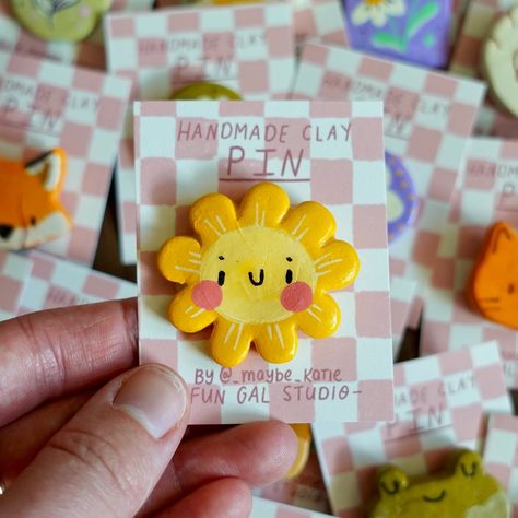 summer market product reveal pt 2 - new pins!! making these is my new obsession >:) I got some requests for kitties, bumblebees, & more forest critters so I’ve added a bunch of them to my pin lineup! I also did a ton of happy hippy flower friends & some other handpainted flower designs that I think turned out so dang cute 🌼 come see me at @edmfolkfest this weekend to snag your favourite—the artisan market starts TOMORROW, woooo!! Art Products Ideas, Clay Crafts For Friends, Clay Art Magnet, Clay Friends, Flowers Polymer Clay, Flowers Market, Handmade Magnets, Pins Ideas, Clay Pin Designs