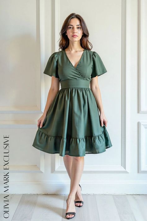 Its olive green hue is as timeless as it is enchanting, while the V-neckline and flutter sleeves add a touch of romantic allure. The cinched waist highlights a feminine silhouette, leading to a flared skirt that dances with movement. Each ruffle is meticulously placed, lending a sense of playful grace. This dress is not just an article of clothing; it's a statement of refined taste and understated luxury. Olive Green Dress, Teacher Clothes, Ruffle Midi Dress, Understated Luxury, Feminine Silhouette, Clothing Inspiration, Winter Clothing, Daily Dress, Flared Skirt