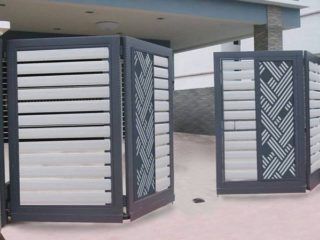 9 Modern Folding Gate Designs With Pictures In India Modern Iron Gate Designs, House Front Gate, Pagar Modern, Modern Steel Gate Design, Latest Gate Design, Modern Main Gate Designs, Home Gate Design, Gate Wall Design, Gate Designs Modern