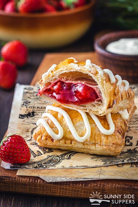 Two strawberry strudels, one cut in half. Strawberry Strudel, Toaster Strudel Recipe, Strawberry Roll, Toaster Strudel, Strudel Recipes, Puff Pastry Dough, Easy Cream, Pastry Crust, Strawberry Filling