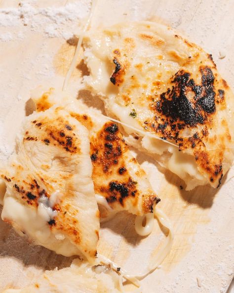 Chewy, cheesy, ever-stretchy cheese naan like this is easier than you think to make at home. Naan Garlic Bread, Cheesy Naan, Naan Garlic, Cheese Naan, Brunch Sides, Plant Based Yogurt, Garlic Naan, Naan Recipe, Melty Cheese