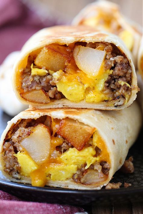 Freezer Breakfast Burritos make mornings on the go easy! Heat in the microwave from frozen and in minutes you have a hearty, delicious meal! Breakfast Burritos For A Crowd, Breakfast Sandwich Meal Prep, Freezer Burritos, Make Ahead Breakfast Burritos, Potatoes And Eggs, Easy Breakfast Burritos, Frozen Burritos, Microwave Breakfast, Portable Breakfast