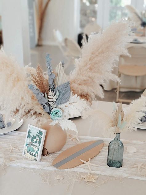 Baby on Board Baby Shower | CatchMyParty.com Beach Centerpiece Ideas, Baby On Board Centerpieces, Surfboard Centerpiece Ideas, Beach Babe Baby Shower Theme, Surfer Boy Baby Shower Ideas, Boho Beach Baby Shower Ideas, Beach Themed Baby Shower Ideas, Surfer Baby Shower Ideas, Beach Theme Baby Shower Ideas