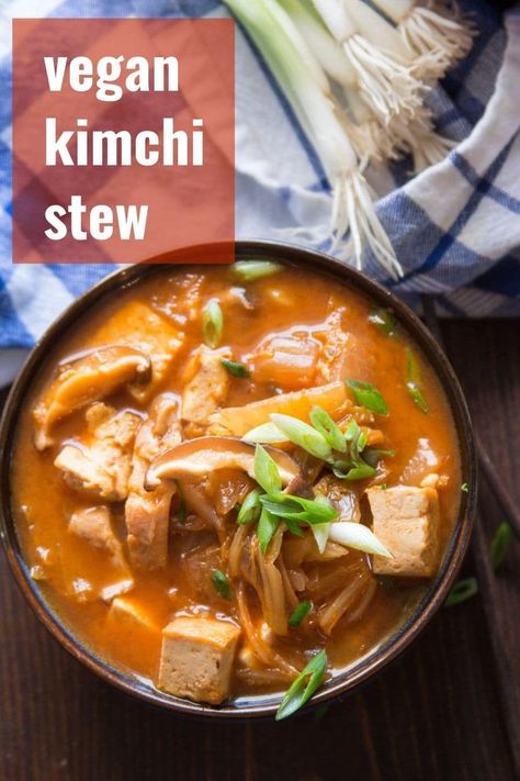 Warm up, with this spicy kimchi stew that's made with with tender shiitake mushrooms and crispy pan-fried tofu! Easy, vegan, and packed with spicy flavor, this cozy meatless stew is hearty enough to make a meal of and perfect on cold winter days. #veganrecipes #koreanfood #kimchi #tofu #stew #meatlessmonday Meatless Stew, Vegan Stew Recipes, Tofu Stew, Kimchi Stew, Spicy Kimchi, Healthy Vegan Dinner Recipes, Vegan Kimchi, Healthy Vegan Dinner, Vegan Stew