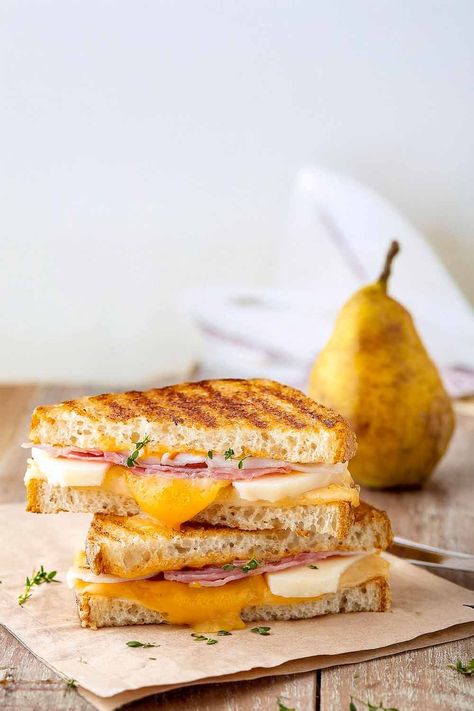 Melty cheese, sweet pear, and a tangy balsamic glaze. A combination that just pops.   I can't take my eyes off this sandwich. Isn't it almost too pretty to eat?  I said almost.  - Kalle Pear Grilled Cheese, Balsamic Cherries, Winter Appetizers, Canned Pears, Grill Cheese Sandwich Recipes, Classic Grilled Cheese, Soups And Sandwiches, Grilled Cheese Sandwiches, Pear Recipes