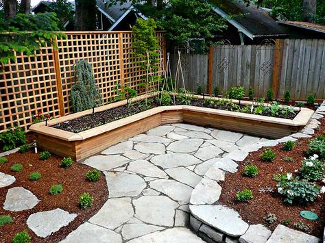 An L-shaped vegetable raised bed hugs the northeast corner of the lower backyard, with a tall trellis forming the backdrop and giving privacy, late May Raised Garden Bed Corners, Beautiful Raised Garden Beds, Backyard Garden Beds, Small Courtyard, Vegetable Beds Raised, Building A Raised Garden, Backyard Garden Landscape, Corner Garden, Small Backyard Gardens