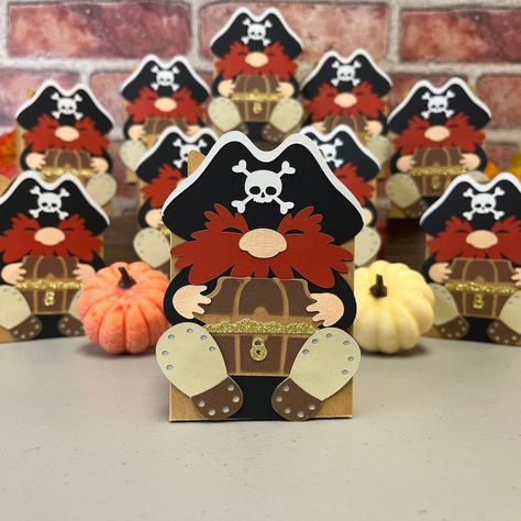 Set sail on a Halloween adventure with our Set of 10 Pirate Treat Gable Boxes! Perfect for pirate-themed parties and spooky celebrations, these handcrafted boxes feature a charming bearded pirate design and are made from high-quality cardstock. They're not just treat holders – they double as eye-catching decorations! Fill them with sweets, tiny gifts, or cash surprises, and watch your guests' faces light up. Easy to assemble and ship flat, these boxes are a must-have for your next event. Halloween Treat Boxes Cricut, Gable Box Packaging, Halloween Gable Boxes, Princess Gable Boxes, Halloween Treat Holders, Halloween Adventure, Pirate Theme Party, Tiny Gifts, Halloween Bash