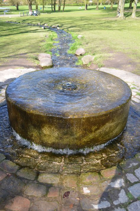 Millstone Fountain, Roskilde, Denmark -- bubbling fountain and babbling freshet Millstone Fountain, Roskilde Denmark, Bubbling Fountain, Mill Stone, Outdoor Water Fountains, Patio Fountain, Fountain Ideas, Small Water Features, Fountains Backyard