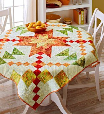 This bright quilt, perfect as a table topper or wall hanging, features a blazing star of fiery red, yellows, and orange batiks. The star shines against a pale green background. Starburst Quilt, All People Quilt, Bright Quilts, Row Quilt, Batik Quilts, Star Burst, Quilted Table Toppers, Quilted Table, Star Quilts