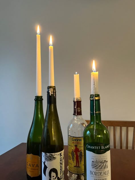 Wine Bottle With Candle Stick, Taper Candle Wine Bottle, Wine Bottle Taper Candle Holders, Candles In Glass Bottles, Wine Bottles As Candle Holders, Candle On Bottle, Wine Bottle As Vase, Vine Bottle Decoration, Winebottle Candleholder Aesthetic