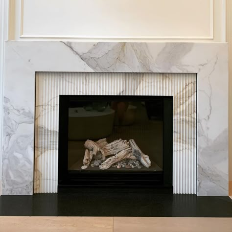 Tiled Fireplaces Ideas, Rh Fireplace, Fluted Marble Fireplace, Marble Fireplace Raised Hearth, Modern Marble Fireplace Mounted, Fluted Marble Fireplace Surround, Honed Marble Fireplace, Viola Marble Fireplace, Marble Fireplace Mantle