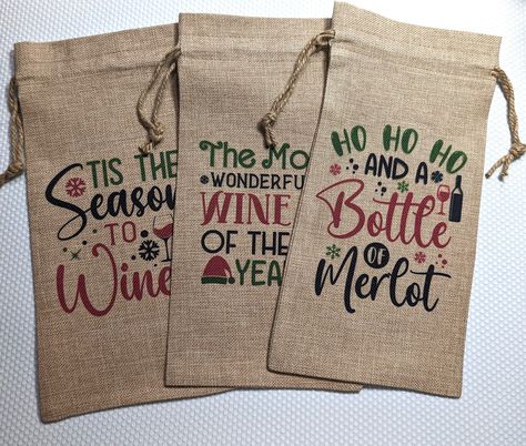 Christmas Wine Bag  - available in several designs to choose from. Perfect to hold a bottle of wine, or any other drink of your choice. Wine bottle bags come in one size. Sturdy and strong to hold your precious gifts.  DESCRIPTION *Drawstring Bottle Bag *100% burlap material SIZES *One Size: 17 x 34cm Please note size is approximate and may very slightly between items. CARE INSTRUCTIONS *Sponge clean only *Do not tumble dry *Do not iron Please note the colours on the finished item may differ from the colours you see on the screen due to the display settings. If you require any special order please message me via Etsy messenger. For any large orders, please get in touch before ordering so I can provide the best offer! Wine Bags Ideas, Wine Bag Quotes, Christmas Party Gifts, Christmas Wine Bags, Wine Bottle Bags, Holiday Wine Bottles, Wine Bottle Gift Bag, Cricut Christmas Ideas, Wine Bottle Tags