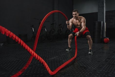 Crossfit battle ropes exercise during at... | Premium Photo #Freepik #photo #man #sports #fitness #gym Functional Training Gym, Sprint Interval Training, Battle Rope Workout, Home Strength Training, Rope Exercises, Muscle Motivation, Cardio Exercise, Strength Training Program, Endurance Workout