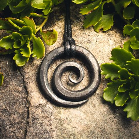 Every piece of jewelry has a soul, a unique story that weaves together history and craftsmanship. Stephen's journey with our hand-forged spiral pendant showcases the heart behind its creation. He shares: "Outstanding craftsmanship! I bought this because it was hand-forged by someone keeping the craft that chose him alive. I didn’t just receive a pendant to wear. I received a story. Thank you! I will be back!" Join us in celebrating craftsmanship that honors tradition and self-expression—p... Iron Necklace, Celtic Spiral, Spiral Pendant, Celtic Culture, Viking Pendant, Irish Design, Hand Forged Iron, Irish Heritage, Celtic Art