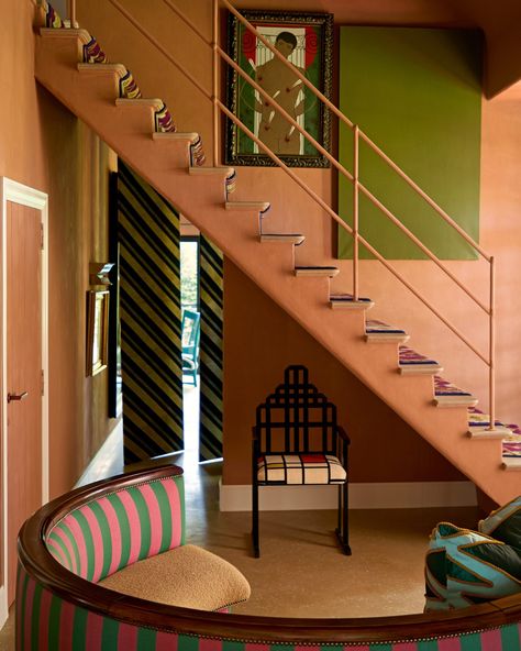 Designer @jpdemeyer's West Flanders home is a testament to his ability to interweave color and varied styles in a very beautiful way. This welcoming seating area bathed in terracotta tones features a curved, 1940s sofa upholstered with French terry fabric and Jean-Philippe's own striped fabric. Would you like a full tour? . Photography by @hautebohemiansmfv / @interiorarchive . See more teracotta decorating ideas at the link in bio. . #homesandgardens #terracotta #stairs #interiordesign Terracotta Stairs, 1940s Sofa, Tour Photography, House Stairs, Striped Fabric, Terry Fabric, French Terry Fabric, Upholstered Sofa, Seating Area