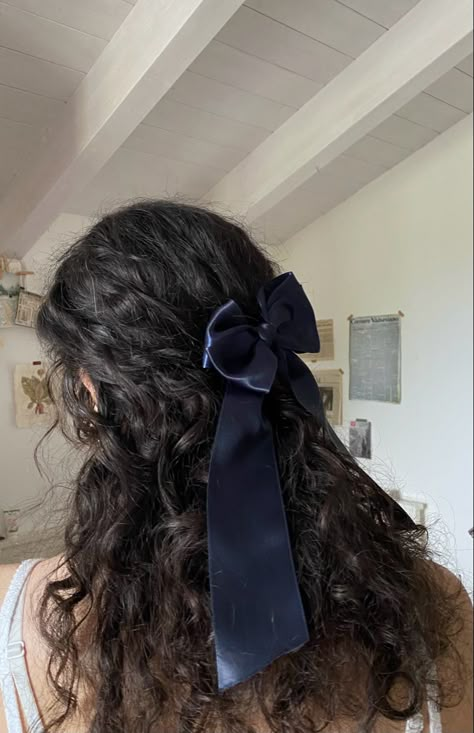 a blue satin bow sits prettily in my girlfriend’s curly dark hair #bows #dainty #sapphic #curlyhair Curly Bow Hair, Blue Ribbon Hairstyle, Hair Bow Curly Hair, Bows Curly Hair, Bows In Curly Hair, Curly Black Hair Aesthetic, Bow Curly Hairstyle, Bow In Curly Hair, Dark Curly Hair Aesthetic