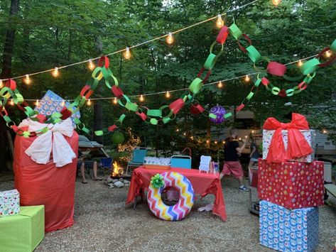 Christmas in July at camp.  Learn how I made Christmas come in the middle of summer Christmas Campsite Decorations, Christmas In July Outdoor Decorations, Campground Christmas In July, Camping Christmas Decorations, Christmas In July Party Decorations, Christmas In July Camping Ideas, Christmas In July Decorations Diy, Christmas In July Decor, Christmas In July Camping Decorations