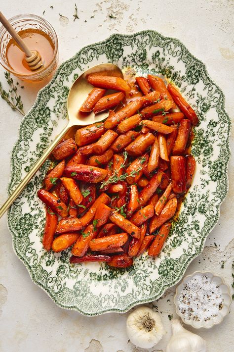 My maple-glazed carrots are a quick and easy side dish that my whole family loves! Perfect for weeknight dinners or a beautiful addition to your holiday table. With a mix of vegan butter, pure maple syrup (or honey), garlic, and fresh herbs, this easy recipe is a hit even with picky eaters! Aip Sides, Blackened Chicken Recipe, Maple Glazed Carrots, Glazed Carrots Recipe, Southern Greens, Honey Roasted Carrots, Dairy Free Cream Cheese, Christmas Meal, Carrots Recipe