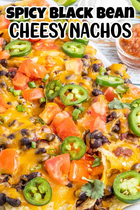 Nachos are a classic snack for just about any occasion – especially if they’re topped with melted cheese and spicy beans! And when you use your oven to bake them on a sheet pan, you have a delicious snack that’s also easy to prepare. That’s why this recipe for spicy black bean nachos is sure to be a hit at any get-together. Everyone will love the crispy chips topped with cheese and a spicy bean mixture, making it perfect for a party. Black Bean Nachos Recipe, Beans For Nachos, Oven Nachos Recipes, Bean And Cheese Nachos, Bean Nachos Recipe, Oven Nachos, Spicy Nachos, Black Bean Nachos, Loaded Nachos Recipe