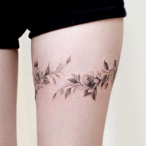 Garland Tattoo On Thigh, Flower Tattoo Around Thigh, Two Thigh Tattoos, Vines Tattoo Thigh, Floral Tattoo On Thigh, Tulip Tattoo Thigh, Floral Thigh Wrap Tattoo, Tattoo Inner Thigh Women, Vine Tattoos On Thigh