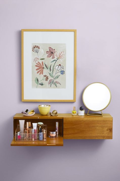 Hang a Floating Vanity Free up floor space by hanging a shelf with a trapdoor, perfect for hiding your most-used makeup and beauty products. Top with a mirror and pretty accessories for quick touch-ups. Click through for more bedroom storage ideas!    #floatingvanity #floatingvanitybedroom #floatingvanity #bedroomstorage #bedroomstorageideas #bedroomstorageidesforsmallroom Hanging Shelf Makeup Vanity, Floating Drawer Shelves, Vanity Wall Storage, Bedroom Small Vanity Ideas, Fold Up Vanity, Shelf Vanity Ideas Small Spaces, Wall Shelf Vanity, Creative Vanity Ideas Small Spaces, Small Floating Vanity Makeup