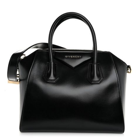 This is an authentic GIVENCHY Shiny Lord Calfskin Small Antigona in Black. This stylish tote is crafted of luxurious calfskinleather in black.The bag features sturdy rolled leather top handles, a leather shoulder strap, and silver hardware, and extended sides. The top zipper opens the bag to a black fabric interior with zipper and patchpockets. Leather Top, Silver Hardware, Black Fabric, Givenchy, Calf Skin, Shoulder Strap, Handles, Zipper, Leather