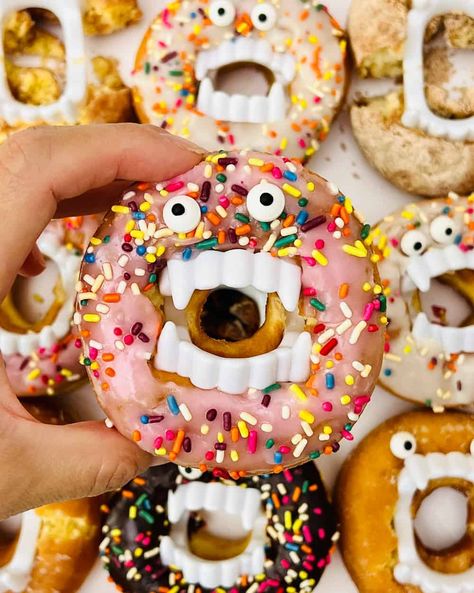 Donut With Vampire Teeth, Monster Donut Ideas, Vampire Donuts Halloween Treats, Halloween Monster Donut Treats, Doughnuts With Vampire Teeth, Halloween Doughnuts With Teeth, Monster Doughnuts Halloween Treats, Donut Monsters For Halloween, Donut Hole Halloween Treats