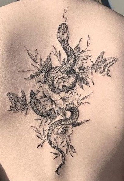 Snake Tattoo Spine, Snake Tattoo With Flowers, Snake Tattoo Feminine, Chest Tats For Women, Floral Snake Tattoo Design, Feminine Chest Tattoo, Spin Tattoos, Snake And Flowers Tattoo, Rose Tattoo On Back