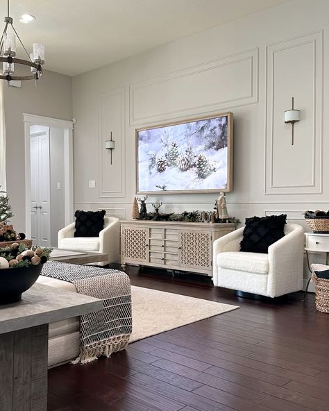 Holiday decor in newly renovated living room. Living Room Wainscoting Ideas Modern, Living Room Border Ideas, Box Trim Tv Wall, Big Wall With Tv Decor Living Room, Cozy Living Room Tv Wall, Large Wall Around Tv Decor, Framed Tv Wall Ideas, Long Blank Wall In Living Room, Black Living Room Wall Ideas