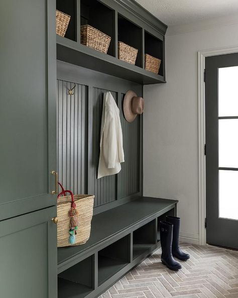 Beautifully design forest green mudroom features a forest green built-in bench boasting shoe shelves and mounted against a forest green beadboard backsplash. Beadboard Drop Zone, Green Drop Zone, Green Beadboard Backsplash, Mudroom And Laundry Room Combo, Green Mudroom, Stacked Laundry Room Ideas, Green Beadboard, Small Laundry Room Design, Room Ideas Small Spaces