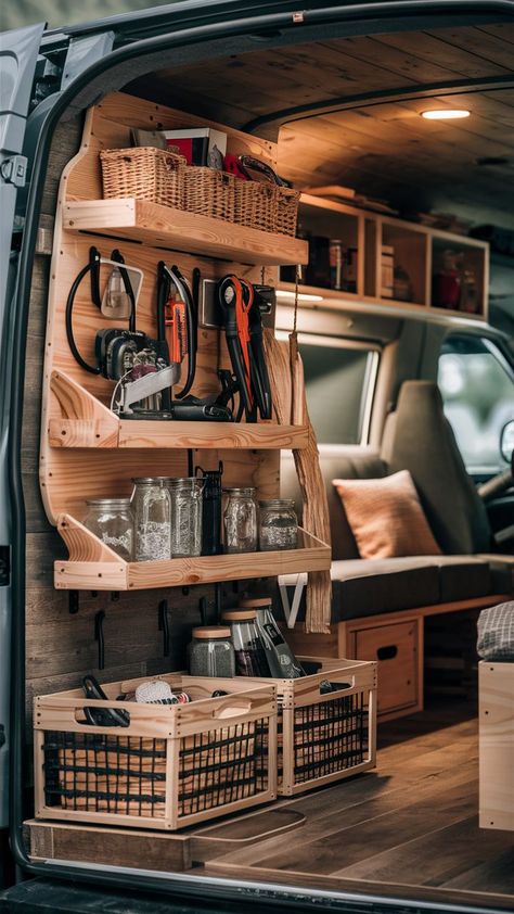 A DIY van conversion featuring a functional gear wall with farmhouse-style storage and flip tables. Diy Van Storage Ideas, Van Drawers, Van Storage Ideas, Campervan Storage Ideas, Van Organization, Gear Wall, Diy Van Conversions, Van Storage, Farmhouse Flair