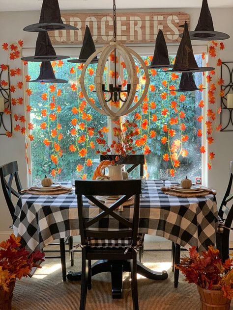 Festive Halloween table decorated with floating witch hats, autumn leaf garlands and buffalo plaid. #floatingwitchhats #fallleafgarlands #buffaloplaiddecor #halloweendecor #halloweendecorating #thedesigntwins Floating Witch Hats, Floating Witch, Burlap Halloween, Festive Halloween Decor, Halloween Window Decorations, Witches Hats, Halloween Tablescape, Halloween Week, Buffalo Plaid Decor