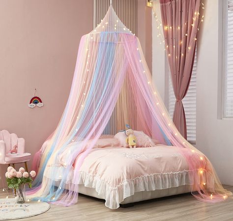 PRICES MAY VARY. Package Include:1 x Bed Canopy + 1 x Lights,height- 90”,net circumference-402” Rainbow Bed Canopy:Our bed canopy is a unique design with pink blue purple pastel color pattern.The rainbow color will brighten up your kids’ bedroom with colorful fun. Canopy For Girls Room Decor: Beautiful Rainbow Decor For Kids room decor, toddler room decor for girls, girls bedroom decor,will let your kid enjoy enough sleep with peace for the kids' sleep health. Easy To Use:All the installation ac Bed Canopy With Lights, Rainbow Bed, Princess Canopy Bed, Canopy Bed Curtains, Kids Canopy, Baby Canopy, King Sized Bedroom, Lace Bedding, Princess Bed