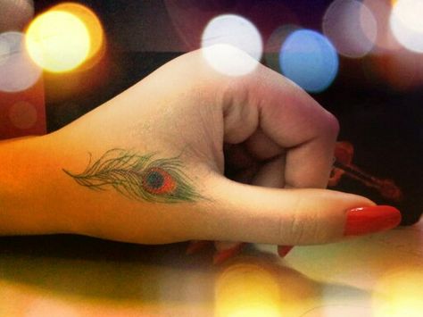 #Peacock #feather  #tattoo #morpankh Morpankh Mehndi, Morpankh Mehandi Design, Morpankh Tattoo, Small Peacock Tattoo, Feather Tattoo Placement, Flute Tattoo, Small Music Tattoos, Feather Tattoo Wrist, Trishul Tattoo Designs