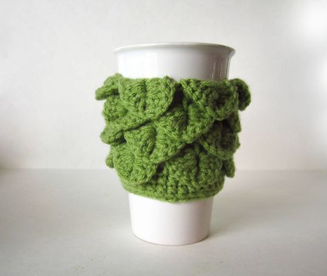 Dragon Scale Cup Cozy in Light Green - Crochet Coffee Sleeve Perfect to keep your drinks warm and your hands protected. This beautiful Dragon Scale cozy makes a lovely gift! This handmade coffee sleeve is reusable and eco-friendly. Great for hot or cold drinks. Fits most standard to-go cups. Check out my other cup cozies https://www.etsy.com/ca/shop/MadebyJody666?section_id=17119190&ref=shopsection_leftnav_2 Crochet Cup Holder, Cactus Cup, Jennifer Wood, Crochet Coffee, Crochet Cactus, Handmade Plushies, Crochet Dragon, Mug Warmer, Mug Cozy