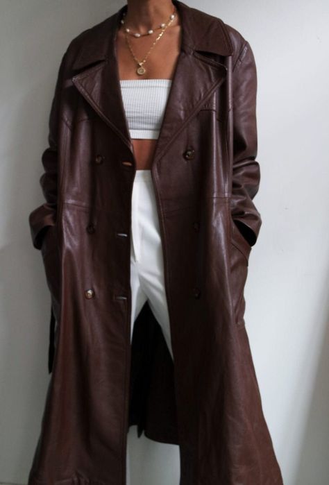 Indulge in timeless elegance with our Women's Long Trench Coat in Vintage Brown, a nod to the iconic Boho styles of the 90s. Crafted from sumptuous sheepskin leather, this maxi-length overcoat offers luxurious comfort and durability. Featuring a double-breasted design, it seamlessly merges vintage charm with contemporary sophistication. Perfect for spring, its soft and supple leather ensures a comfortable wear experience. Elevate your wardrobe with this statement piece that exudes confidence and How To Style Leather Coat, Long Brown Trench Coat, French Style Fashion Winter, Long Brown Leather Jacket Outfit, Brown Leather Trench Coat Outfit, Brown Leather Coat Outfit, Long Leather Coat Outfit, Brown Leather Jacket Outfits Women, Leather Style Women