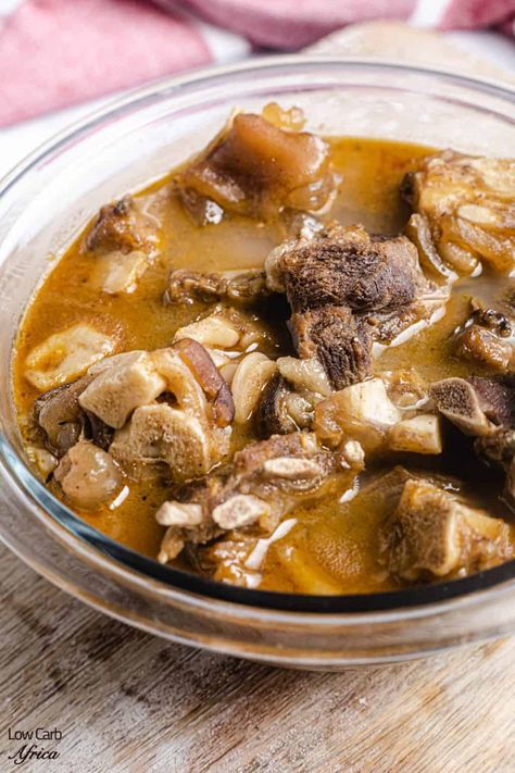 This goat meat pepper soup is a favorite Nigerian soup that is so nutritious and filling. It's heartwarming, ethnic flavors will cheer you up and soothe your soul! #lowcarbrecipe #ketorecipe #paleo #glutenfree #nigerianrecipe #peppersoup #africanrecipe | LowCarbAfrica.com African Soup Recipes, Goat Meat Pepper Soup, African Pepper Soup, Goat Stew Recipe, African Soups, Rice And Stew, Goat Soup, Ghanaian Recipes, Nigerian Soups