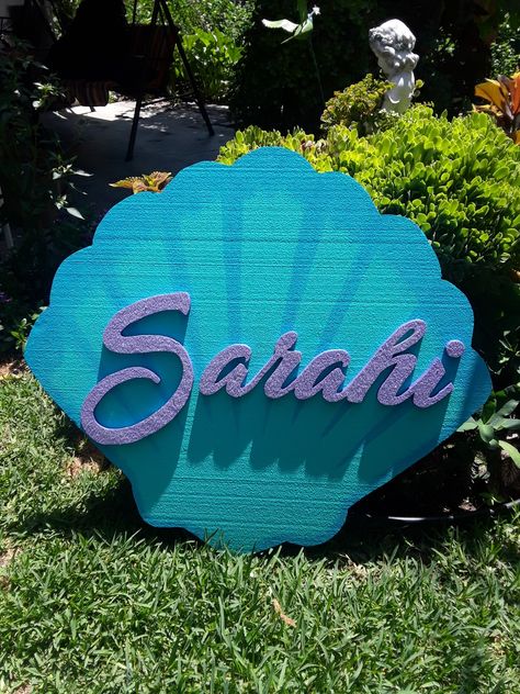 Styrofoam sea shell backdrop name, little mermaid, mermaid party, backdrop Diy Seashell Backdrop, Mermaid Photo Backdrop Diy, Mermaid Backdrop Ideas, Ariel Birthday Party Backdrop, Mermaid Birthday Party Photo Booth, Shell Backdrop, Mermaid Party Photo Op, Diy Mermaid Shell Backdrop, Mermaid Party Backdrop