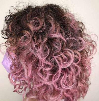 Tricolor Hair Highlights, Pink Hair Highlights Curly, Brown Roots Colored Hair, Peekaboo Hair Color Curly Short, Pink Peekaboo Highlights Curly Hair, Underlayer Hair Dye Curly, Dusty Pink Curly Hair, Curly Hair With Colored Tips, Curly Hair With Pink Tips