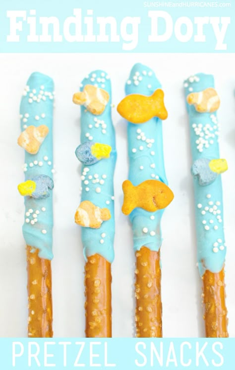 Planning a Finding Dory Birthday Party? These adorable dipped pretzel rods with their under the sea theme would be a perfect party snack! They would also work for a Finding Nemo Party, An Under the Sea Party or even just a pool party. Simple to make, fun to eat, kids will love them. Finding Dory Snacks from SunshineandHurricanes.com Easter Pretzels, Finding Dory Birthday Party, Vbs Snacks, Dory Birthday Party, Finding Dory Party, Finding Nemo Party, Finding Dory Birthday, Nemo Birthday Party, Lila Party