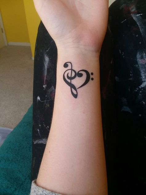 Got this bass and treble clef heart at Ironhorse Tattoo!! Music Tattoo Treble Clef, Bass Clef Treble Clef Heart Tattoo, Heart With Music Notes Tattoo, Treble And Bass Clef Heart, Treble Bass Clef Tattoo, Tattoo Treble Clef, Musical Heart Tattoo, Treble Clef And Bass Clef Tattoo, Music Tramp Stamp