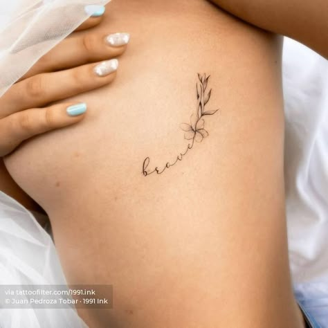 Fine line "brave" + flower tattoo on the rib Mini Tattoos Side Rib, Flowers Side Tattoo, Small Fine Line Rib Tattoo, Tattoo Ideas Female Side Ribs Flower, Minimalist Tattoo Side Rib Women, Small Flower Tattoo On Ribs, Woman’s Rib Tattoo, Script Floral Tattoo, Rib Age Tattoo