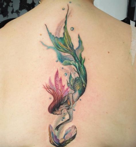 20+ Of The Best Spine Tattoo Ideas Ever Watercolour Mermaid Tattoo, Mermaid With Pearls Tattoo, Diving Mermaid Tattoo, Mermaid Spine Tattoo, Colorful Mermaid Tattoo, Realistic Mermaid Tattoo, Little Mermaid Tattoo Ideas, Mermaid Tattoo Ideas For Women, Under The Sea Tattoo Ideas